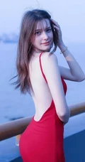 气质柔美红色露背装连衣裙欧美女生海边护栏美拍写真