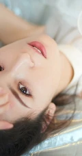 丸子头女生哈妮克孜轻纱白裙仙气十足写真图片