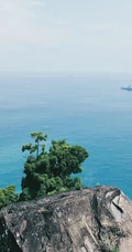 海上的礁石，溶洞风景手机背景图片