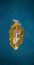 航拍海上的小岛，灯塔的唯美海上风景手机壁纸