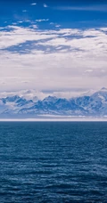 海上晚霞，海边的雪山手机壁纸套图