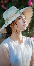 手拿鲜花带帽子的清纯美女高清手机壁纸