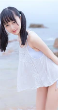 夏日海边穿着清凉的双马尾辫软可爱女生唯美清新写真图片