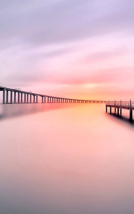 超清的夕阳下的跨海大桥摄影手机锁屏壁纸