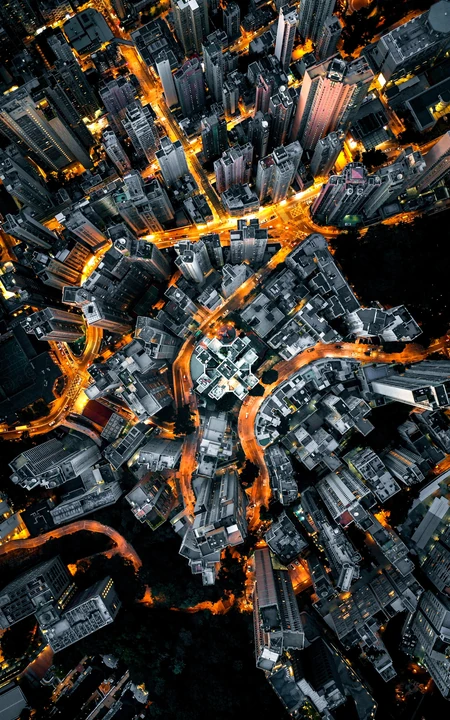 高清航拍夜间的繁华城市流动的车灯风景
