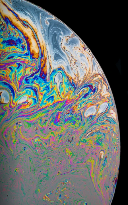 苹果手机系统自带的炫彩液体星球的手机壁纸