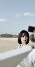 段奥娟学生装格子短裤唯美海边写真图片
