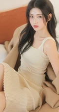脸蛋红润粉扑扑的高颜值长腿少女肩带针织衫连衣裙穿搭室内写真图片