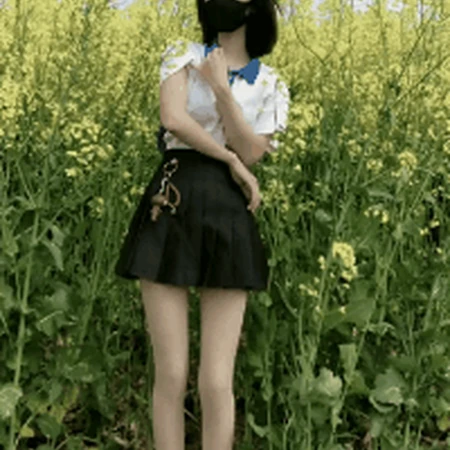 油菜花地里的短发短裙气质女生可爱跳舞gif动态图片
