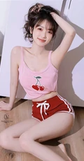 笑容超甜的双马尾气质浅粉少女身着可爱樱桃背心短裤居家吃樱桃写真图集