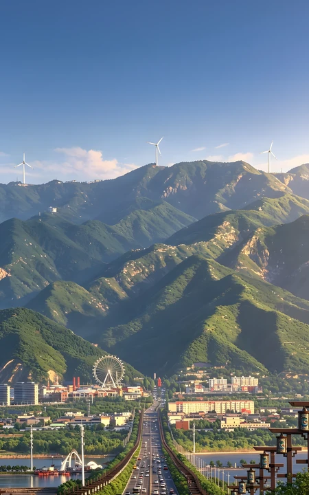 山脚下城市公路与摩天轮自然城市风光